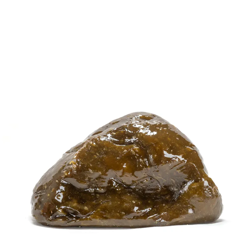 Close-up view of hash rosin showing its texture and color.